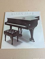 Front album cover with grand piano artwork