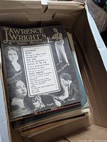 Open box with stack of sheet music on edge, top piece Lawrence Wright’s 4th Song Annual visible