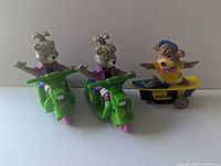 Front view showing two Cindy Bear scooter toys and one Boo Boo skateboard toy