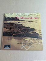 Front album cover showing title, artist, shoreline image, MCA logo