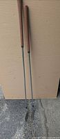 Full view of both irons standing upright