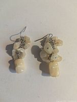 Pair of cream agate chip dangle earrings, front view