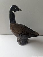 Brown glass Canada goose shaped bottle, empty