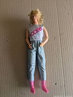 Front view of Ken doll with original outfit