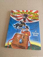Front cover of 1957 Saalfield Around the World in 80 Days coloring book