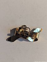 Back view showing pin mechanism and bail