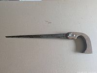 Full view of keyhole saw showing blade and wood handle