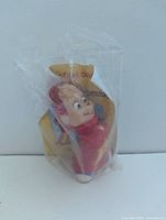 Alvin figurine sealed in original KFC plastic packaging