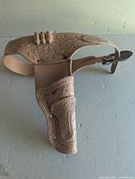 Full view of molded plastic gunbelt with holster