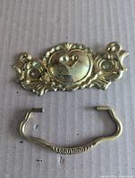 backplate and bail handle on cardboard background