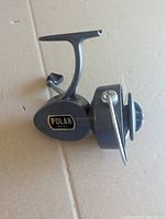 Left side view showing brand badge, body and bail
