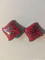 Diamond-shaped red enamel earrings with pagoda design