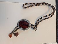 Full bolo tie showing slide, cord and tips