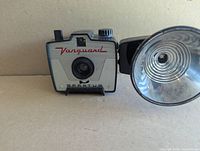 Front view of Spartus Vanguard camera attached to flash unit