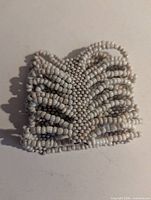 front view of white milk glass beaded wrap bracelet
