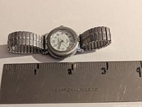 Watch next to ruler showing size and expansion bracelet
