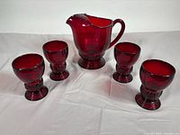 Pitcher with four tumblers, full lot