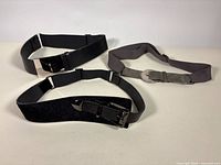 All three Suzi Roher belts displayed flat