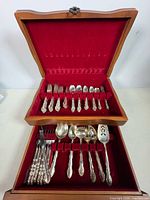 Open chest showing full set of flatware in two tiers