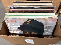Box filled with LP records, front record Tony Bennett Sings His All-Time Hall Of Fame Hits visible