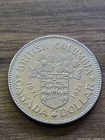 Reverse of 1971 Canadian dollar showing British Columbia arms and inscriptions