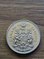Reverse of 1973 Canada 50 cent coin showing coat of arms