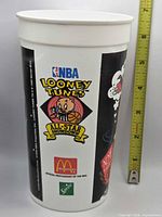 Front view showing NBA Looney Tunes All-Star Showdown logo with McDonald's and Sprite logos alongside height reference