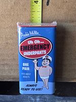 Front of blue package showing product name and cartoon sailor