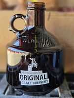 Front view showing logo, color, handle and threaded neck