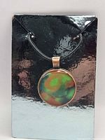 Front view of pendant on backing card