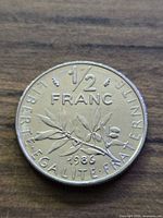 Reverse showing 1/2 FRANC, olive branch, date 1986
