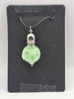 Front view of necklace showing pendant shape and color