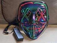 Front view of iridescent EL wire mask with battery pack