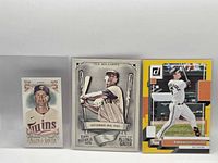 All three sleeved cards side by side: Happ, Williams, Mountcastle