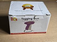 Retail box showing PAG tagging gun, quantity of fasteners and needles