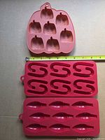 All three silicone molds with tape measure showing ~8 in. length