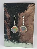 Front view of both earrings displayed on reflective card