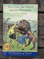 Front cover showing title, author, anniversary badge, artwork