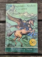 Front cover showing title, author, artwork, 50th anniversary badge