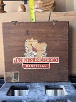 Front view showing Tucketts Preferred label, size reference tape