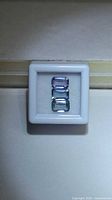 Trio of octagon sapphires in display box, top-down view
