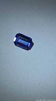 Emerald-cut deep blue Tanzanite front view