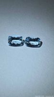 Both aquamarine stones side by side showing overall appearance