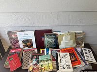 Front and top view showing full assortment of cookbooks on tabletop
