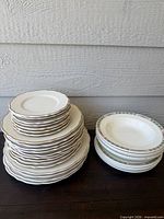 stacked dinner and salad plates plus stack of soup bowls