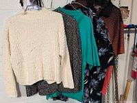 Group of five hanging garments