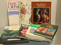 Front view showing all seven books upright and stacked