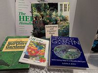 All five books standing and stacked