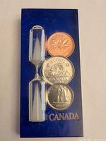 Front of blister pack showing all three coins