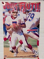 Front view of full poster showing Doug Flutie image and team logo